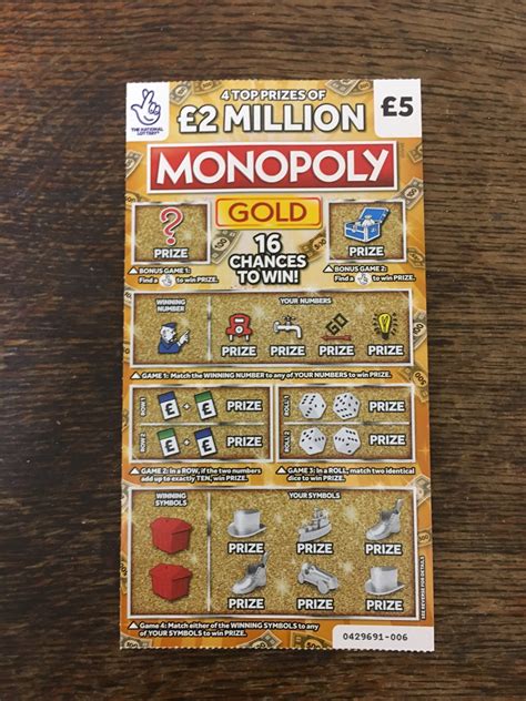 Monopoly Gold National Lottery Scratch Card .